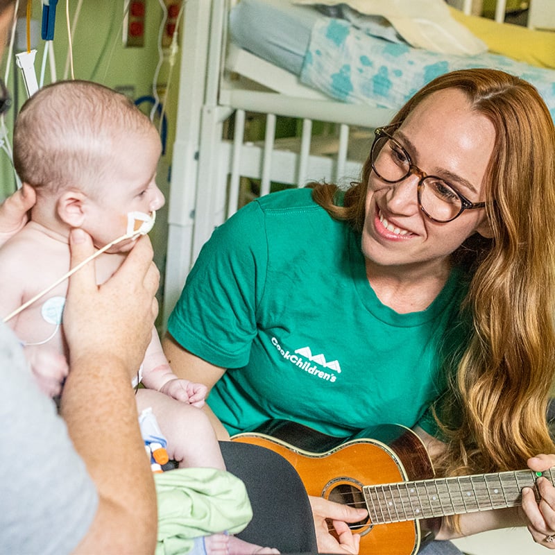 Playing guitar for baby