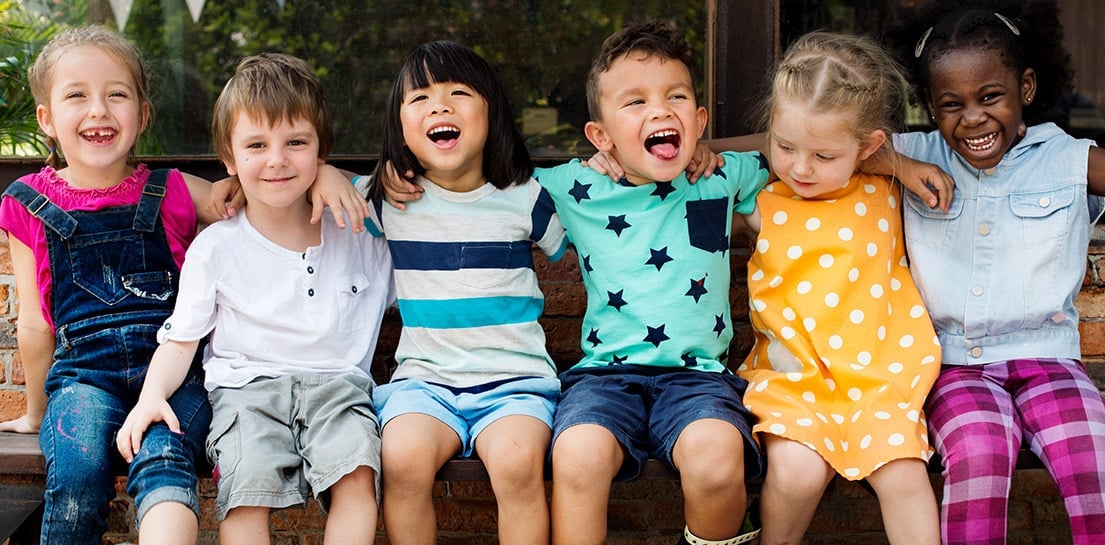 Group of children sitting on a bench